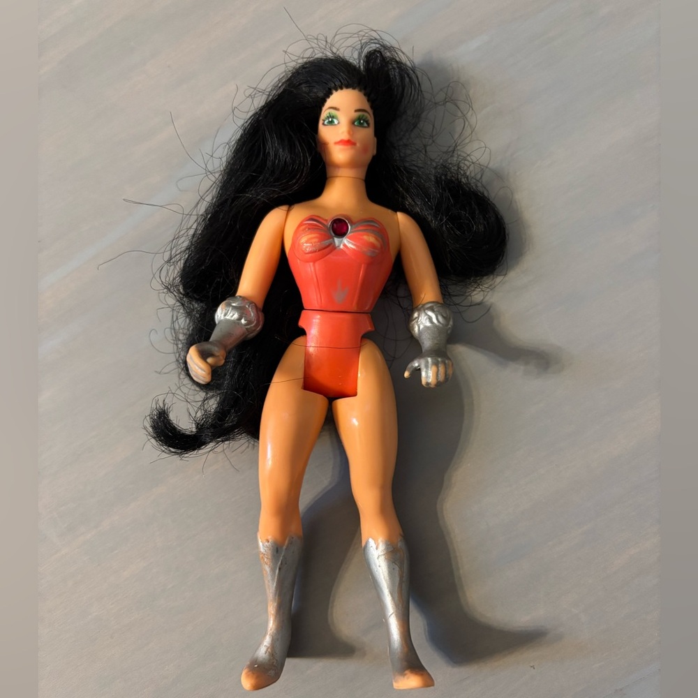 Vintage Action Figure with Red and Silver Outfit